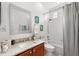 Well-lit bathroom with modern fixtures, including a granite vanity, framed mirror, and a shower-tub combination at 16108 Bristol Lake Cir, Orlando, FL 32828