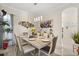 Dining room featuring a modern chandelier, sleek table setting, and contemporary decor at 16108 Bristol Lake Cir, Orlando, FL 32828