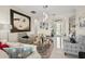 Stylish living room with decorative seating, contemporary art, and tile floors at 16108 Bristol Lake Cir, Orlando, FL 32828