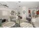 Open-concept living area with eat-in kitchen, casual dining area, and comfortable seating at 16108 Bristol Lake Cir, Orlando, FL 32828