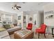 Inviting living space featuring sofa, office space, and red accent chairs, with natural light at 16108 Bristol Lake Cir, Orlando, FL 32828