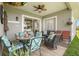 Inviting covered patio with comfortable seating, ceiling fan, and outdoor décor, perfect for relaxing or entertaining guests at 16108 Bristol Lake Cir, Orlando, FL 32828