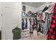 Spacious walk-in closet providing ample storage space for clothes, shoes, and accessories with shelves, drawers and hanging rods at 16108 Bristol Lake Cir, Orlando, FL 32828