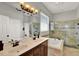 Spacious bathroom featuring double sinks, large shower and soaking tub at 1657 Tennyson Ct, Lake Mary, FL 32746