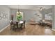 A naturally lit dining area with neutral decor, large windows, and decorative accents at 1657 Tennyson Ct, Lake Mary, FL 32746