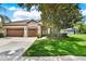 Well-maintained home featuring a three-car garage, lush landscaping, and inviting curb appeal at 1657 Tennyson Ct, Lake Mary, FL 32746
