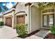 Inviting home exterior highlighting a three-car garage and a covered front entry at 1657 Tennyson Ct, Lake Mary, FL 32746