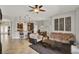 Open-concept living area showcasing tile flooring and providing access to kitchen and dining spaces at 1657 Tennyson Ct, Lake Mary, FL 32746