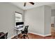 Functional home office with hardwood floors, natural light, and a modern desk setup at 1657 Tennyson Ct, Lake Mary, FL 32746
