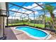 Enjoy this screened-in pool area with a tropical view, perfect for relaxing and entertaining at 1657 Tennyson Ct, Lake Mary, FL 32746