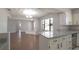 Open concept dining area featuring a view of the kitchen and living room at 1668 Fort Smith Blvd, Deltona, FL 32725
