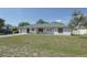 Classic single-story home featuring a well-maintained lawn and attached one car garage at 1668 Fort Smith Blvd, Deltona, FL 32725