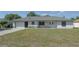 Charming single-story home with a well-manicured lawn and attached one car garage at 1668 Fort Smith Blvd, Deltona, FL 32725