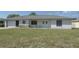 Inviting single-story home with manicured front lawn and attached one car garage at 1668 Fort Smith Blvd, Deltona, FL 32725