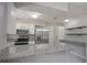 Kitchen featuring stainless steel appliances, granite countertops, and an island with a breakfast bar at 1668 Fort Smith Blvd, Deltona, FL 32725