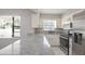 Kitchen area featuring granite countertops, stainless steel appliances, and lots of natural light at 1668 Fort Smith Blvd, Deltona, FL 32725