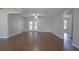 View of large living room featuring beautiful hardwood floors and a ceiling fan at 1668 Fort Smith Blvd, Deltona, FL 32725