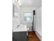 Clean bathroom featuring new fixtures, bright lighting, and a shower-tub combo at 1805 Paloma Ave, Sanford, FL 32771