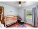 Serene Bedroom with soft colors, hardwood floor, and natural light creates a calming space at 1805 Paloma Ave, Sanford, FL 32771