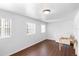 Bright empty room with laminate floors, white walls, and simple decor at 1805 Paloma Ave, Sanford, FL 32771