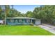 Charming single-story home featuring a well-manicured lawn and an attached garage at 1805 Paloma Ave, Sanford, FL 32771