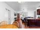Bright living room featuring hardwood floors, TV, ceiling fan, and neutral walls at 1805 Paloma Ave, Sanford, FL 32771