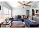 Inviting living room offering a view into an open kitchen with hardwood floors and a ceiling fan at 1805 Paloma Ave, Sanford, FL 32771