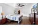 Spacious main bedroom featuring hardwood floors, ceiling fan, and walk-in closet at 1805 Paloma Ave, Sanford, FL 32771
