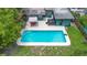 Aerial view of a backyard featuring a rectangular pool, jacuzzi, and patio area at 1805 Paloma Ave, Sanford, FL 32771