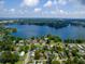 Beautiful aerial view of lakeside home with lush trees and a large lake at 1979 Staunton Ave, Winter Park, FL 32789