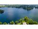 Aerial view of lakefront properties featuring tree coverage at 1979 Staunton Ave, Winter Park, FL 32789