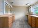 Bathroom with double sinks, cabinets, and ample counter space at 1979 Staunton Ave, Winter Park, FL 32789