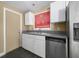 Well-lit kitchen with stainless steel appliances, white cabinets, and functional layout at 1979 Staunton Ave, Winter Park, FL 32789