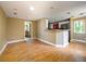 Inviting living room featuring gleaming hardwood floors, neutral walls, and open layout at 1979 Staunton Ave, Winter Park, FL 32789