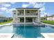 Backyard pool with a small spa and brick paver patio and covered lanai at 2060 Panoramic Cir, Apopka, FL 32703