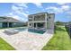 Backyard features a pool, spa, fire pit, and covered lanai at 2060 Panoramic Cir, Apopka, FL 32703