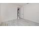 Bright bedroom features light gray wood-look floors and white walls at 2060 Panoramic Cir, Apopka, FL 32703