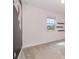 Inviting bedroom with soft carpet, decorated wall, bright window, and floating shelves at 2060 Panoramic Cir, Apopka, FL 32703
