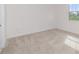 Sun-filled bedroom with a plush carpet, white trim, and a view from the window at 2060 Panoramic Cir, Apopka, FL 32703