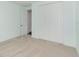 Cozy bedroom showcasing carpet, soft mint walls, a closet, and bright natural light at 2060 Panoramic Cir, Apopka, FL 32703