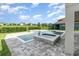 Backyard pool with a small spa and brick paver patio at 2060 Panoramic Cir, Apopka, FL 32703