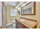 Bathroom featuring granite countertops and a large mirror at 2081 Mohican Trl, Maitland, FL 32751