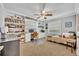 Functional bedroom with large built-in shelving, a desk area, and a cozy daybed at 2081 Mohican Trl, Maitland, FL 32751