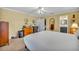 Spacious bedroom has a ceiling fan, neutral carpet, and allows access to a private ensuite bathroom at 2081 Mohican Trl, Maitland, FL 32751