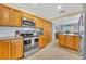 Modern kitchen equipped with stainless steel appliances, granite countertops, and plenty of storage space at 2081 Mohican Trl, Maitland, FL 32751