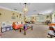 Large living room with bright colors, large windows, ceiling fan, and neutral carpet at 2081 Mohican Trl, Maitland, FL 32751