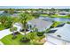 Aerial view of home featuring lush landscaping, picturesque pond, and serene neighborhood at 2135 Springwater Ln, Port Orange, FL 32128