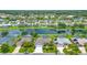 Beautiful waterfront homes with well-manicured lawns and screened patios along a serene canal at 2135 Springwater Ln, Port Orange, FL 32128
