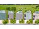 Aerial view of multiple homes featuring swimming pools, lush landscaping, and well-maintained lawns at 2135 Springwater Ln, Port Orange, FL 32128