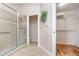 Bathroom with tiled walk-in shower and walk-in closet at 2135 Springwater Ln, Port Orange, FL 32128